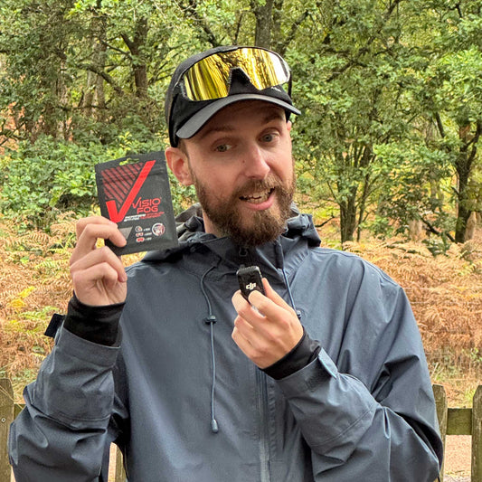 cyclist holding visiofog in the outdoors to use on googles