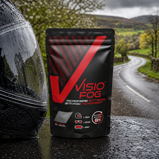 VisioFog anti-fog wipe packet next to a motorcycle helmet for spring riding
