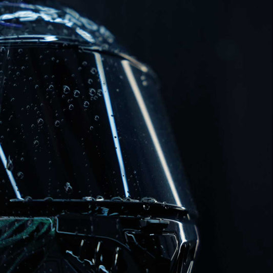 spada motorbike helmet with dark visor and water on it