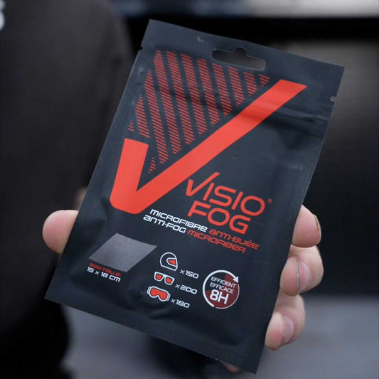 man holding a visiofog microfibre wipe packet for anti-fog on visors